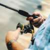 a man is using a fly rod