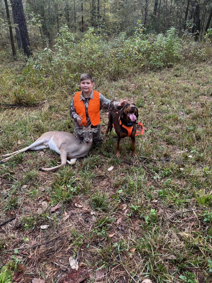 a boy is hunting a deer