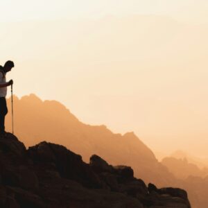 a man is walking in the mountain