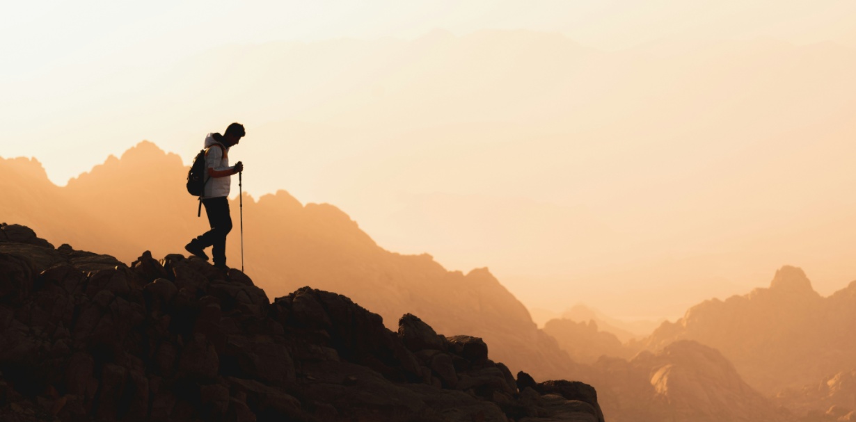 a man is walking in the mountain